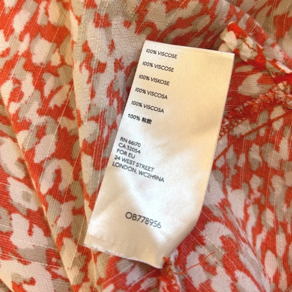 Free People French Quarter mini wrap dress, Small Orange White Animal Print boho